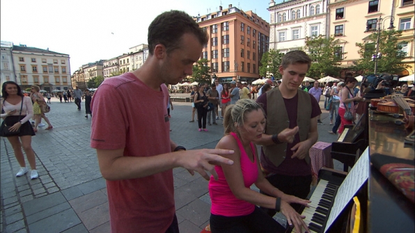 In Detour B, Denise and James Earl (#TeamAlabama) play the piano in Krakow's Old Town Square